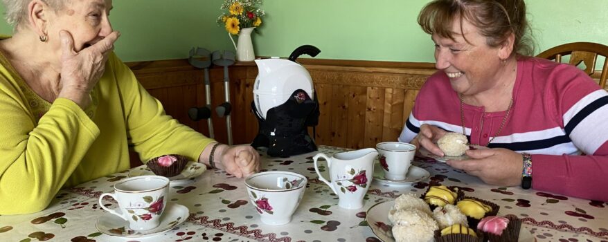 Mother and daughter enjoying afternoon tea with their Uccello Kettle