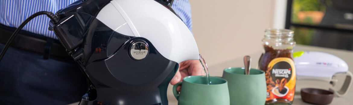 Elderly man using the Uccello Kettle to make tea with the one touch jar opener