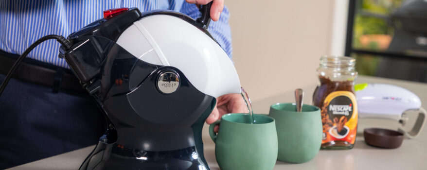 Elderly man using the Uccello Kettle to make tea with the one touch jar opener