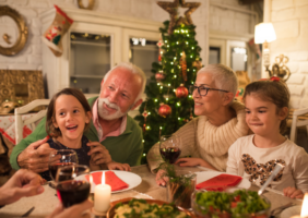Grandparents enjoying Christmas dinner with family