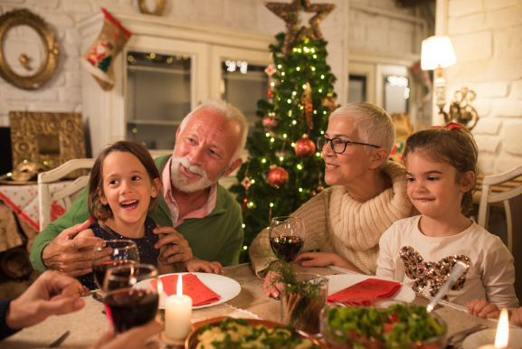 Grandparents enjoying Christmas dinner with family