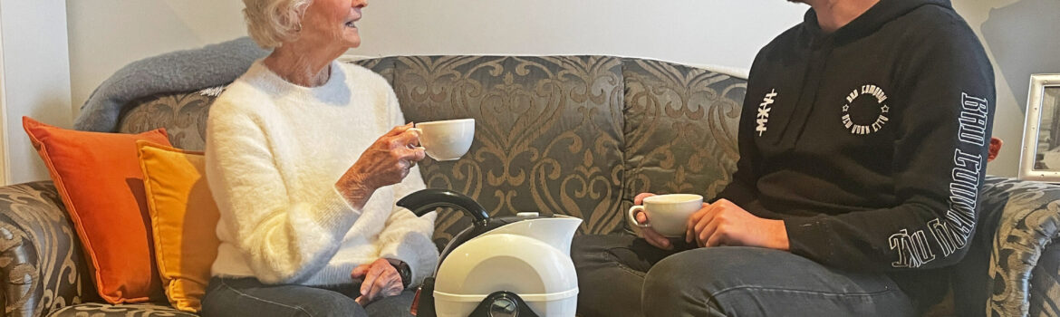 Grandmother and Grandson enjoying tea together with the Ucello Kettle