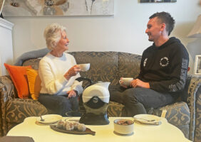 Grandmother and Grandson enjoying tea together with the Ucello Kettle