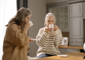 Elderly women drinking tea in the kitchen