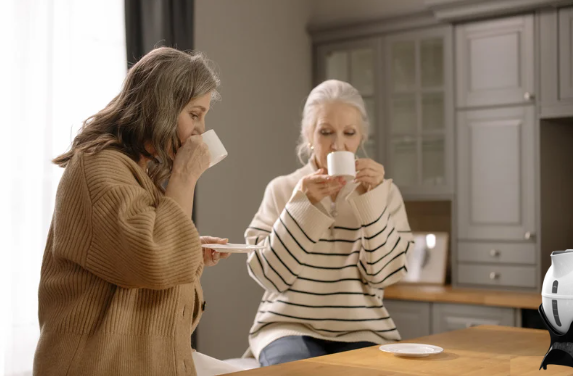 Elderly women drinking tea in the kitchen