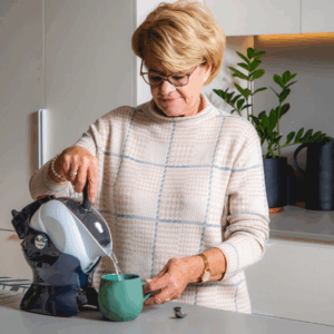 Elderly woman making tea with the Uccello Kettle