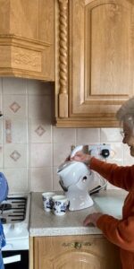 Mother and daughter in the kitchen making tea with their Uccello Kettle