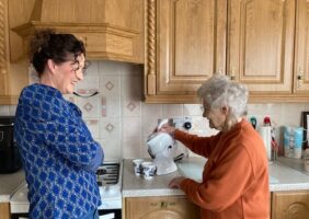 Mother and daughter in the kitchen making tea with their Uccello Kettle
