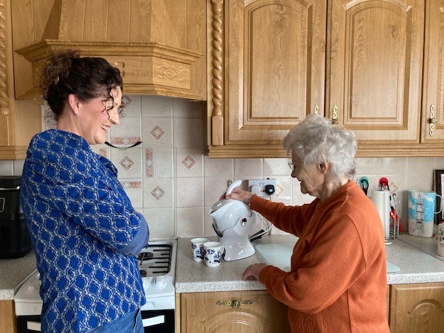 Mother and daughter in the kitchen making tea with their Uccello Kettle