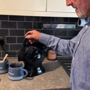 Elderly man making tea with the Uccello Kettle