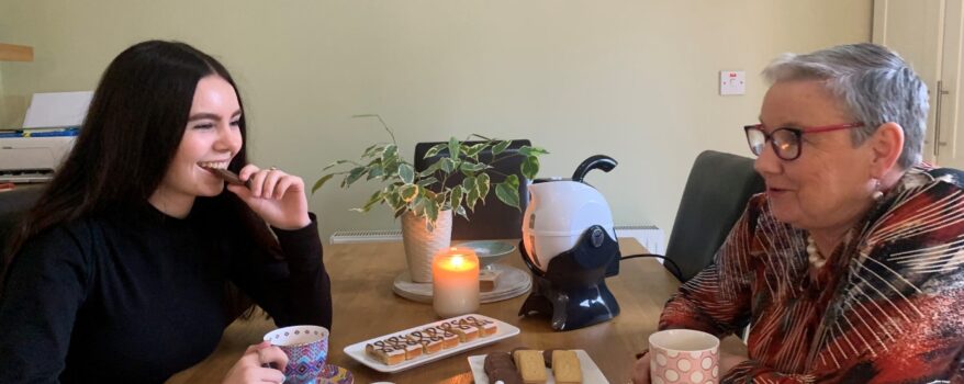 Grandmother and Granddaughter enjoy a cup of tea together