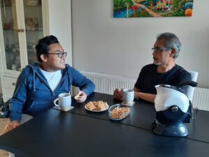 Father and Son enjoy tea and cake together