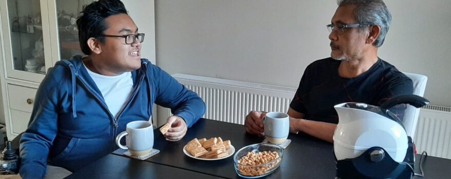 Father and Son enjoy tea and cake together